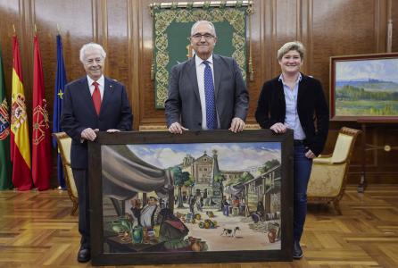 foto de grupo con cuadro de la plaza de los ajos